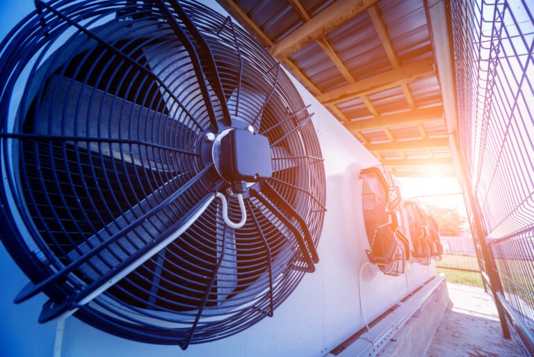 Commercial outdoor air conditioning condenser units installed for climate control